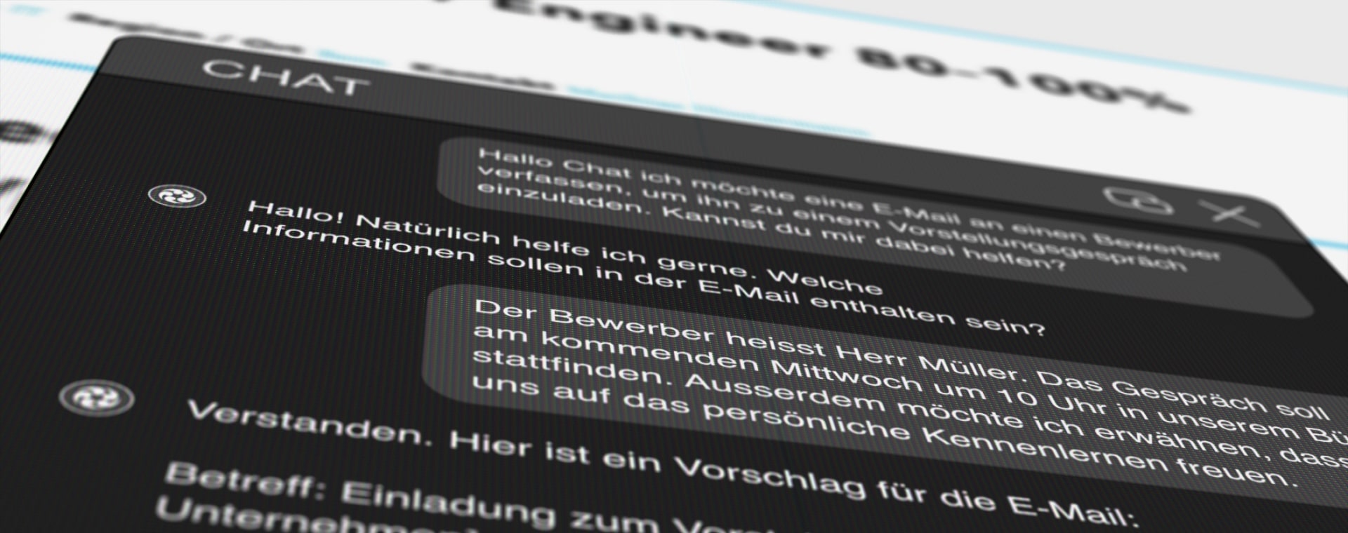 Der Bildschirm zeigt einen Chatverlauf in einem dunklen Design. Ein Benutzer hat nach Hilfe beim Verfassen einer E-Mail für ein Vorstellungsgespräch gefragt. Der Chatbot liefert einen Vorschlag für die E-Mail, einschließlich Betreffzeile und Begrüßung. Das Foto ist unscharf, um die Tiefe des Bildschirms hervorzuheben.